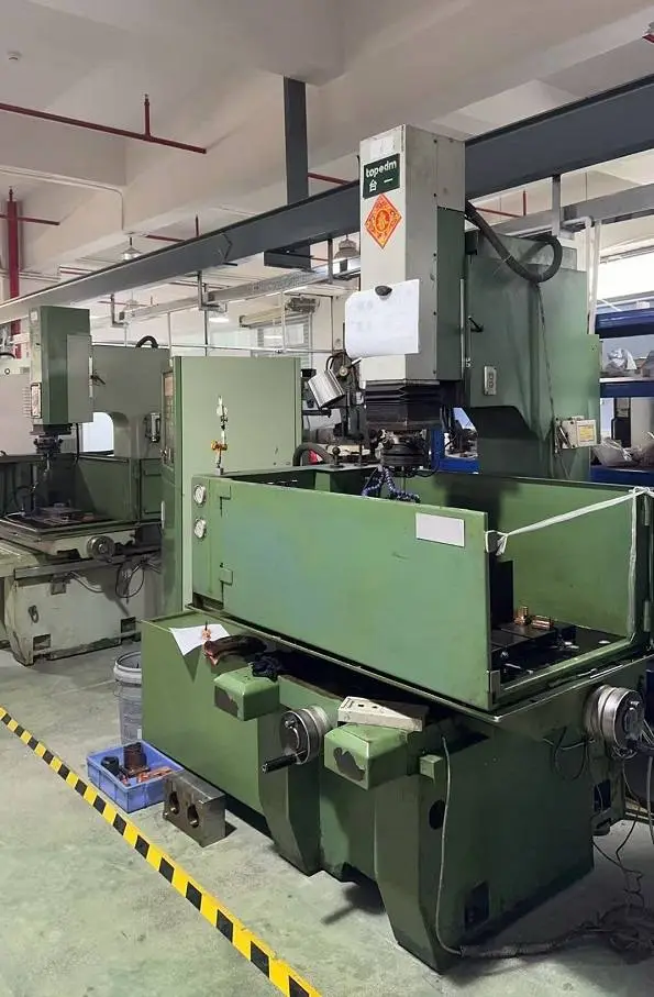 Spark EDM Mmchine in luggage handle production
